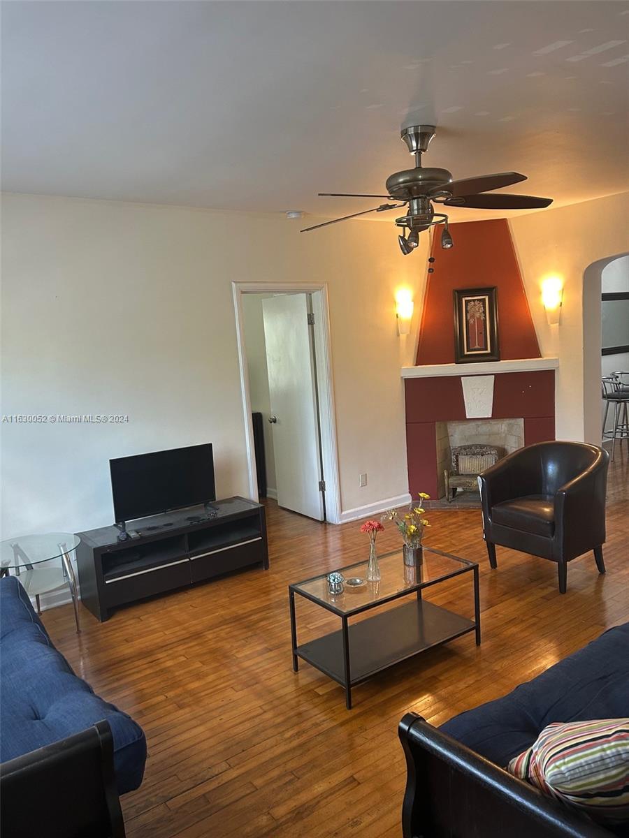 1241 13th Street, Unit 4 Miami Beach, FL 33139 - Photo 3 of 13 a living room with furniture and a wooden floor