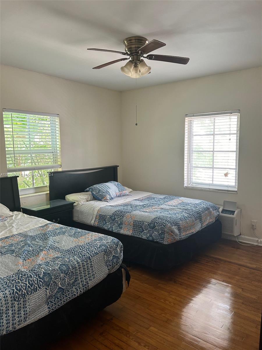 1241 13th Street, Unit 4 Miami Beach, FL 33139 - Photo 8 of 13 a bedroom with double bed and a window