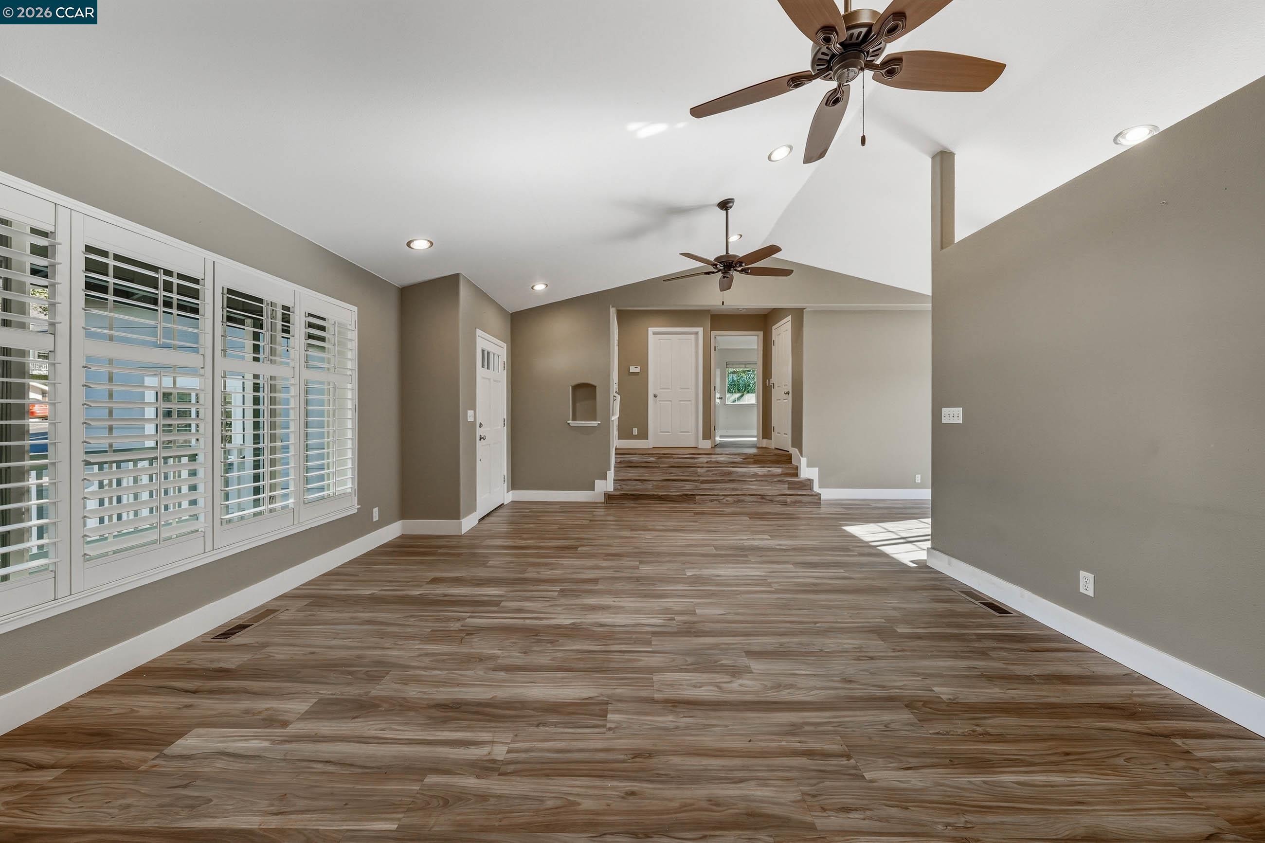 18357 Deer Hill Road Hidden Valley Lake, CA 95467 - Photo 13 of 29 a view of an empty room with wooden floor and a window