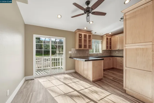 a kitchen with stainless steel appliances a stove microwave and sink