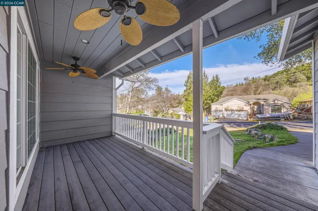 a view of a porch with wooden floor