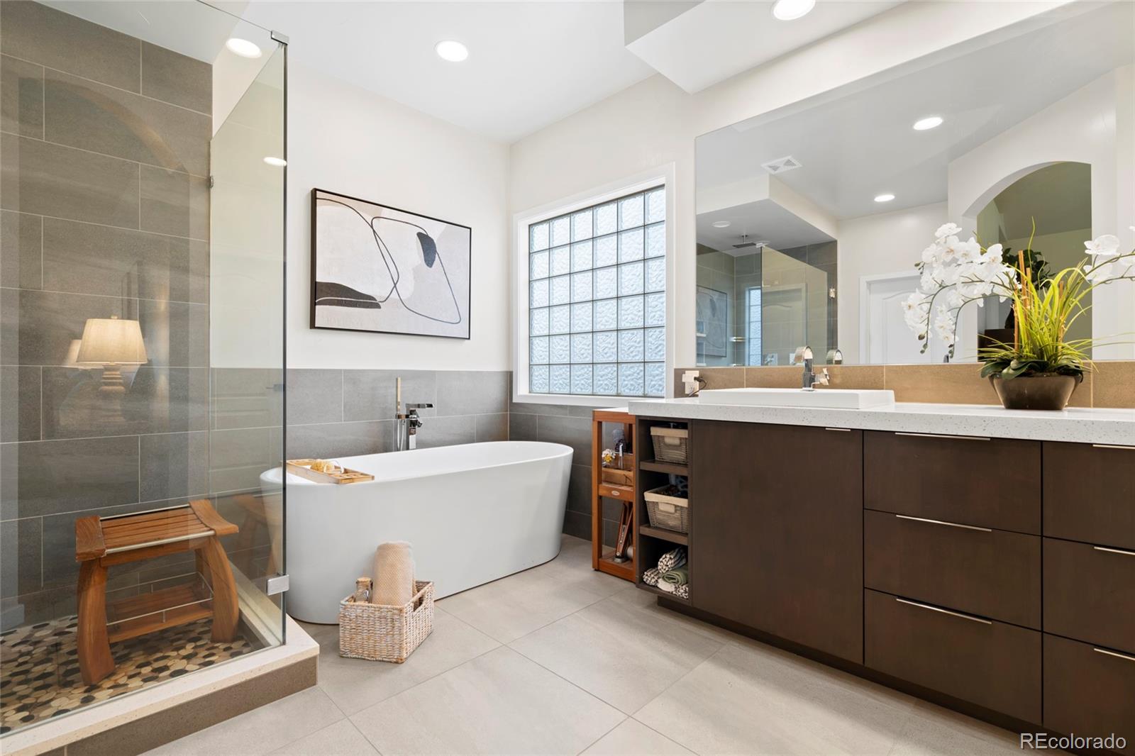 8440 Spinnaker Bay Drive Windsor, CO 80528 - Photo 12 of 36 a bathroom with a tub sink and mirror