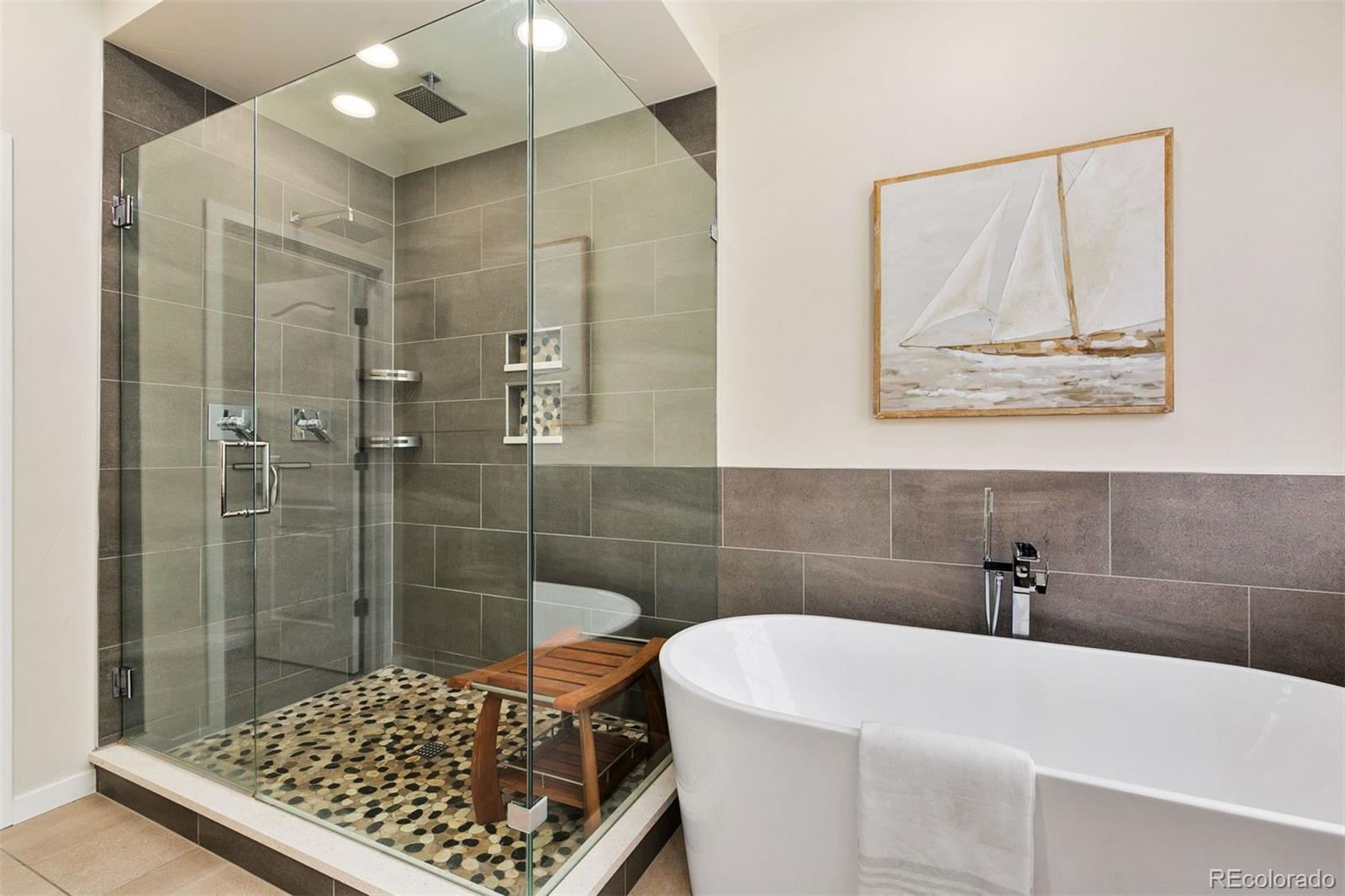 8440 Spinnaker Bay Drive Windsor, CO 80528 - Photo 13 of 36 a bathroom with a bathtub and shower