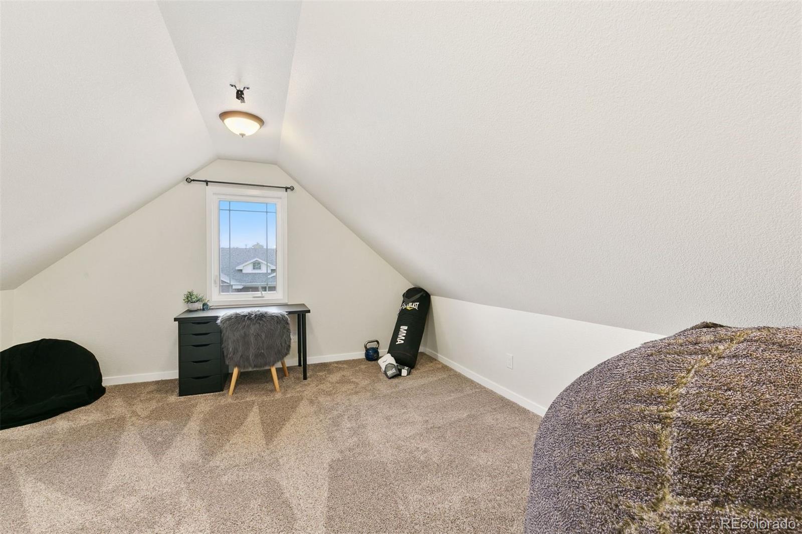 8440 Spinnaker Bay Drive Windsor, CO 80528 - Photo 19 of 36 a bedroom with a bed and cabinets