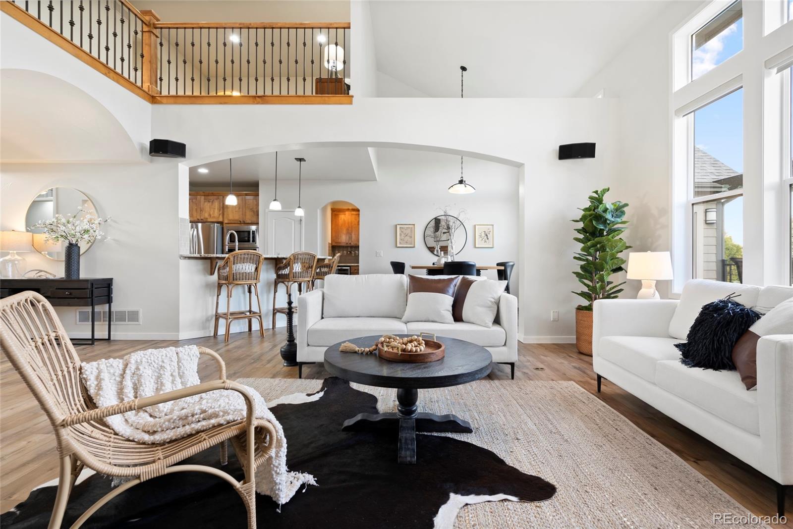 8440 Spinnaker Bay Drive Windsor, CO 80528 - Photo 2 of 36 a living room with furniture a rug and a window