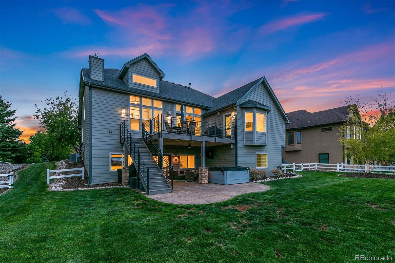 8440 Spinnaker Bay Drive Windsor, CO 80528 - Photo 33 of 36 a view of an house with backyard space and patio
