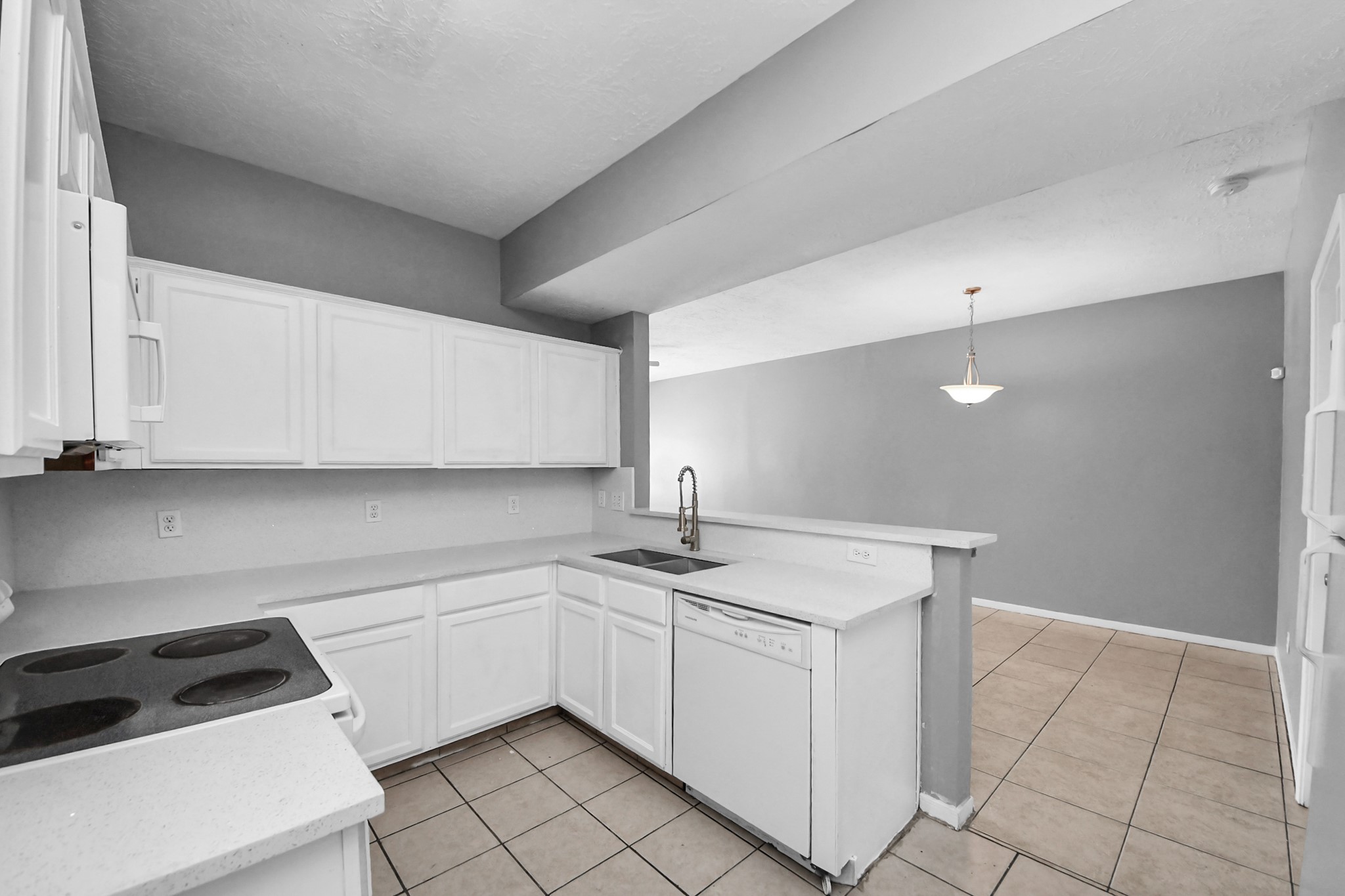 8126 Jutland Road Houston, TX 77033 - Photo 20 of 46 a utility room with cabinets washer and dryer