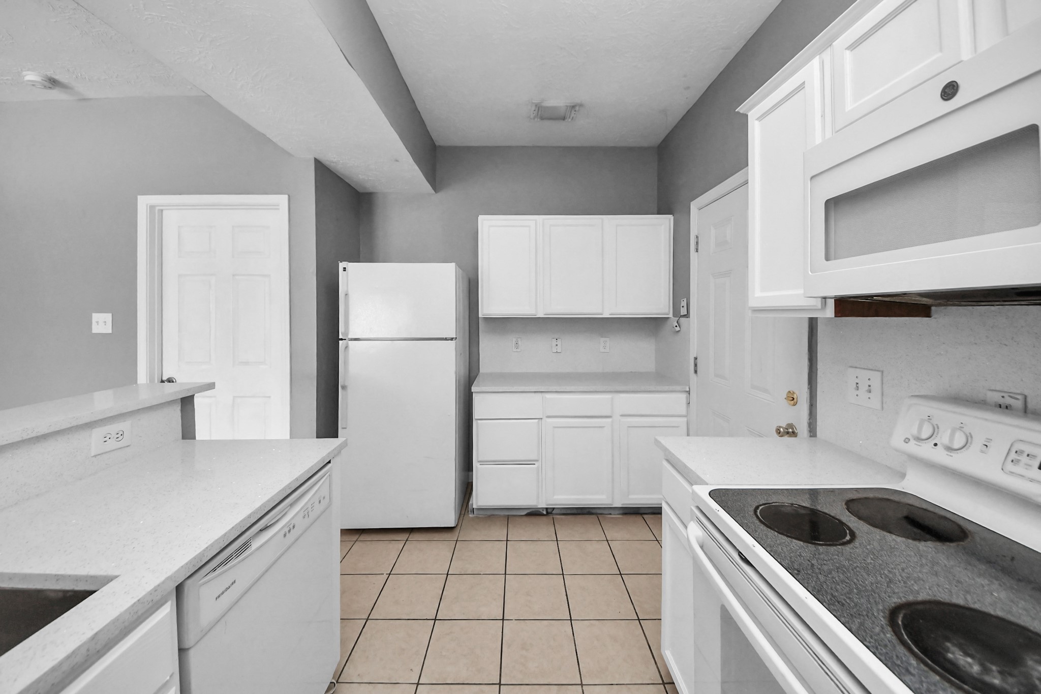 8126 Jutland Road Houston, TX 77033 - Photo 21 of 46 a kitchen with a cabinets and white appliances