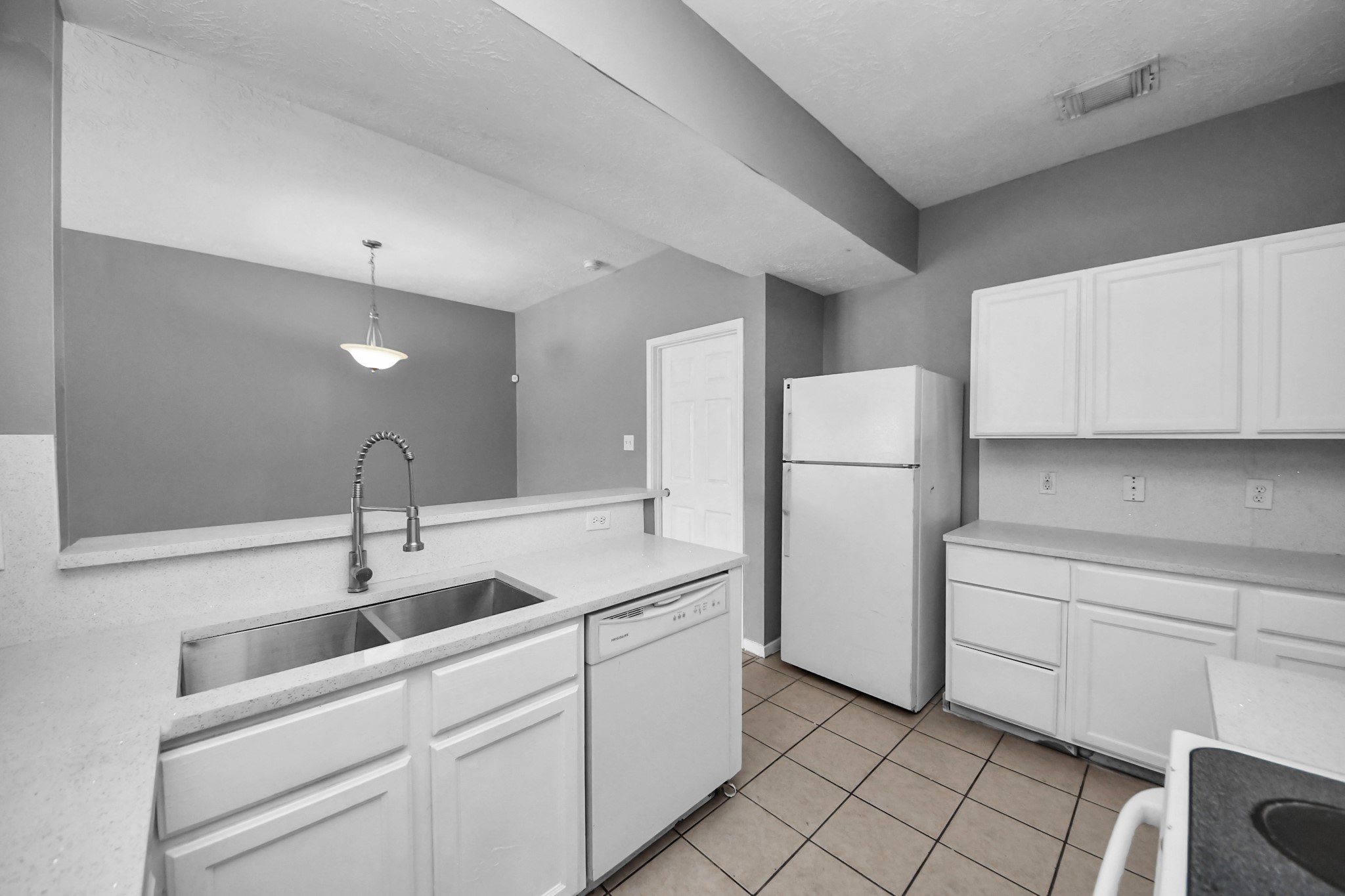 8126 Jutland Road Houston, TX 77033 - Photo 23 of 46 a kitchen with a sink cabinets and appliances