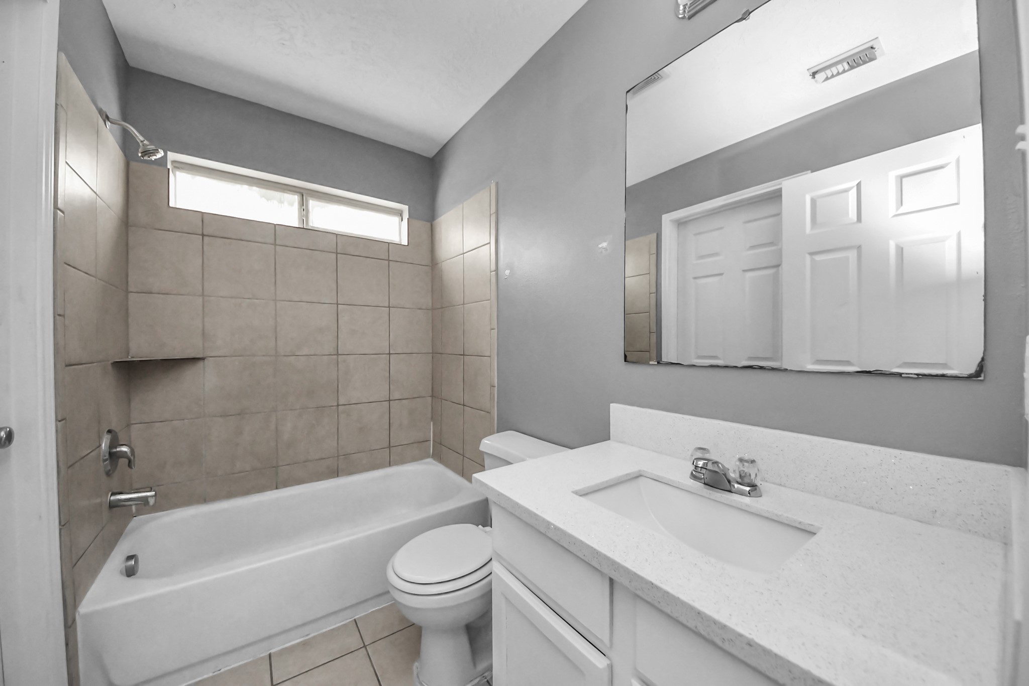 8126 Jutland Road Houston, TX 77033 - Photo 27 of 46 a bathroom with a bathtub shower sink vanity and toilet