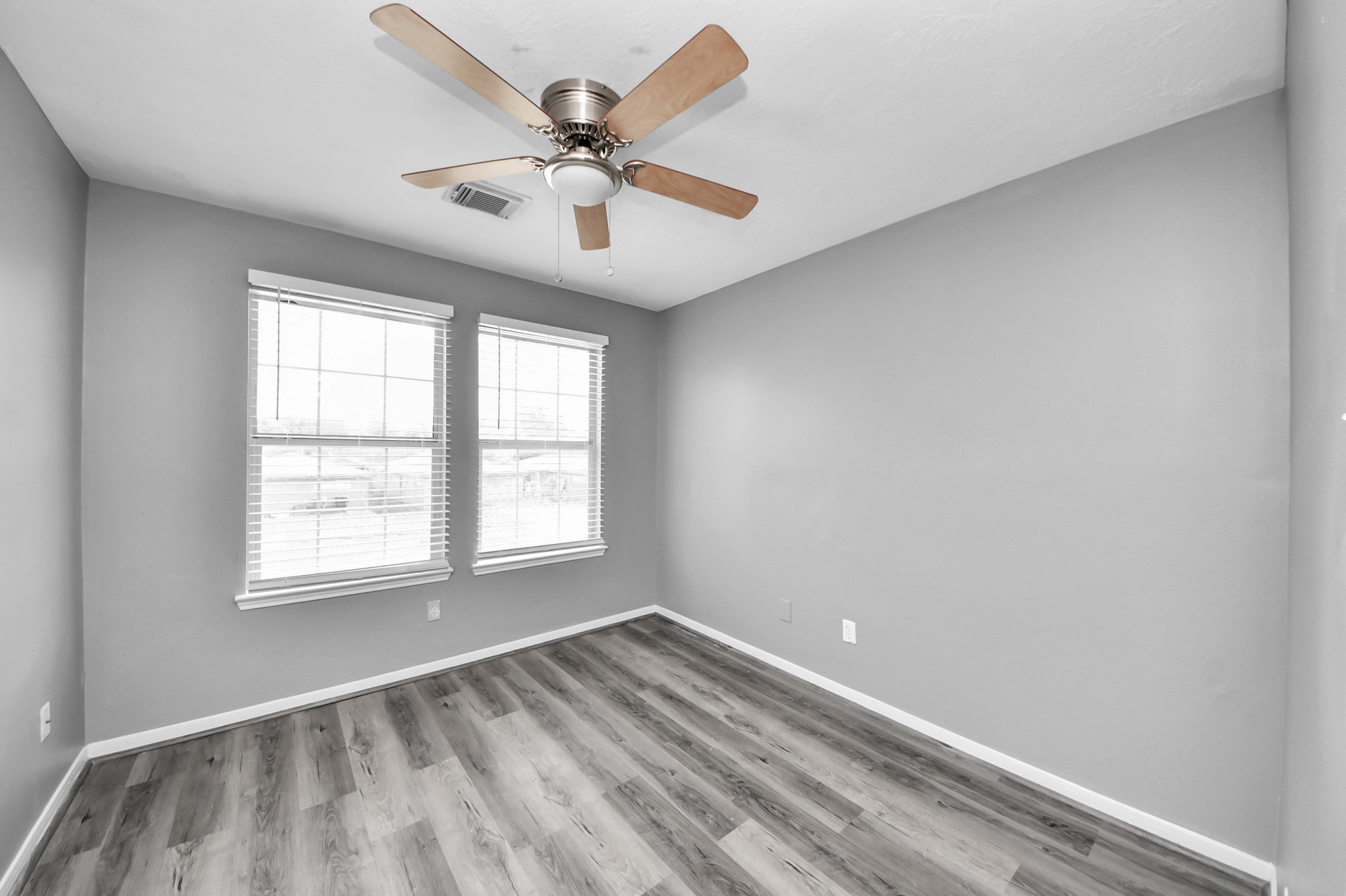 8126 Jutland Road Houston, TX 77033 - Photo 30 of 46 an empty room with a window and a fan