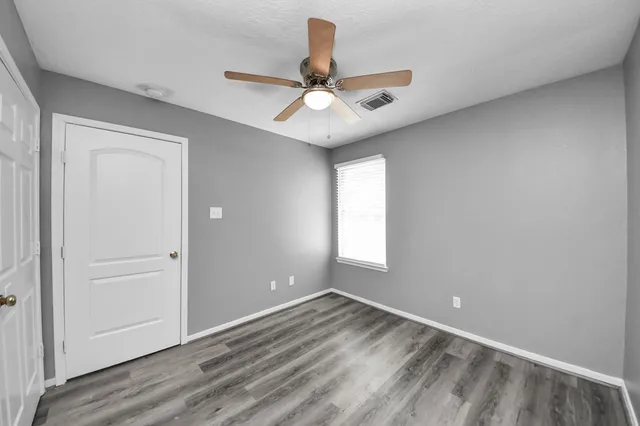 a view of an empty walk in closet