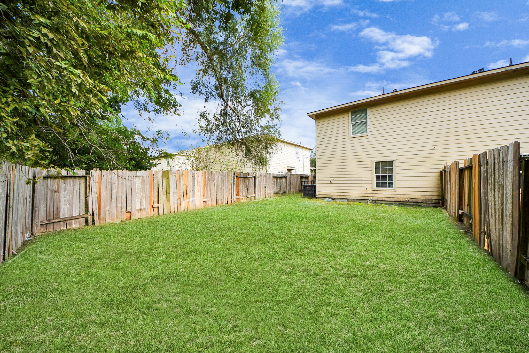 8126 Jutland Road Houston, TX 77033 - Photo 44 of 46 a view of a backyard with wooden fence