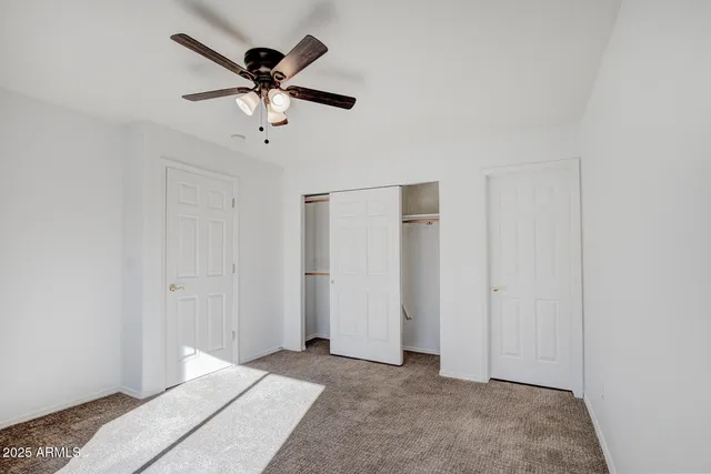 a bathroom with a toilet and a mirror