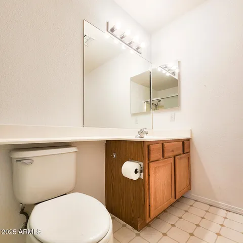 a bathroom with a shower and a toilet