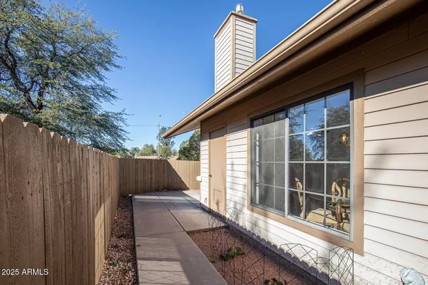 a view of front door and potted plants