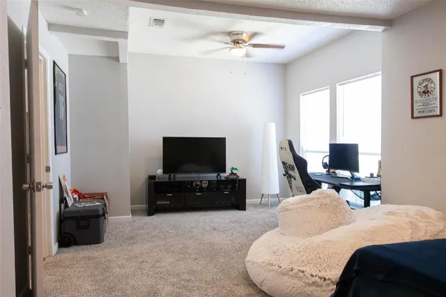 a hotel room with a bed and a television