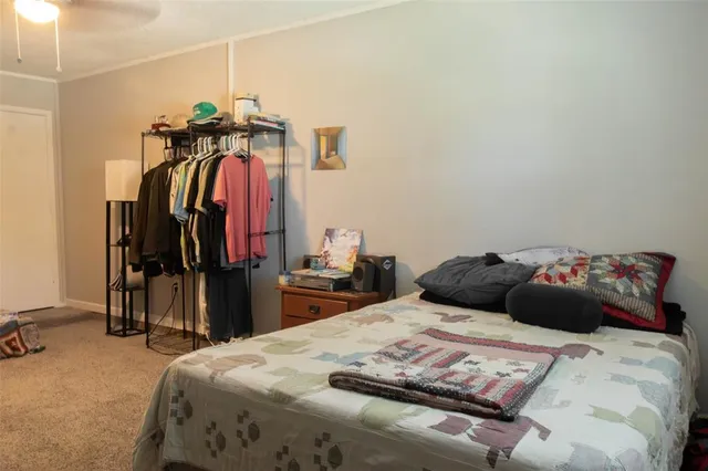 a bedroom with a bed and a closet