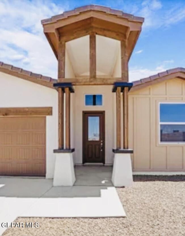709 Rosencrans Street Chaparral, NM 88081 - Photo 5 of 6 a front view of a house with a garden