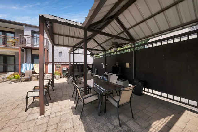 a view of a house with swimming pool and sitting area