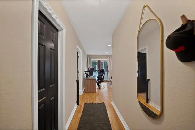 a view of a livingroom with furniture and a window