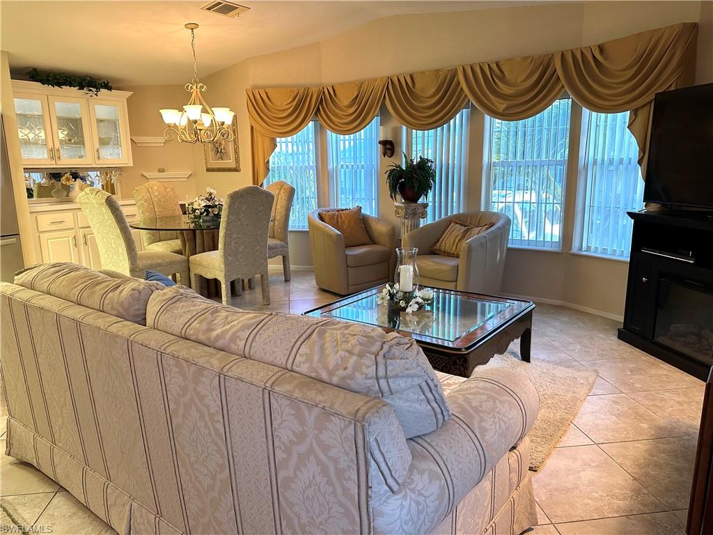 4730 Lantern Lane West Estero, FL 33928 - Photo 11 of 22 a living room with furniture and a window