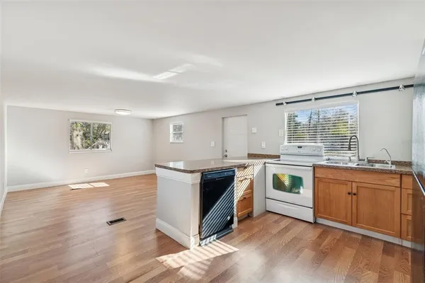 a view of a sink and a window