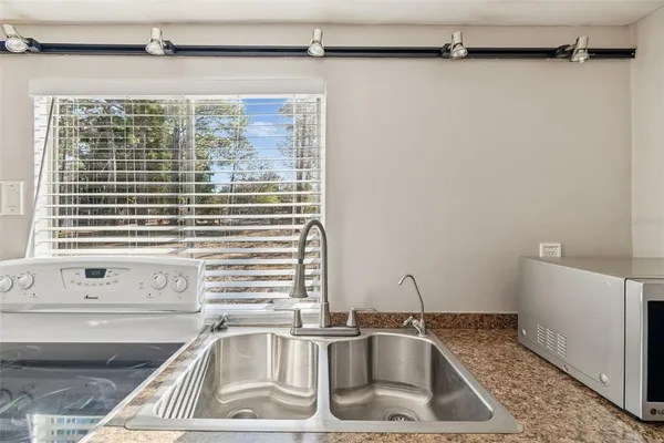 a kitchen with a stove and a sink