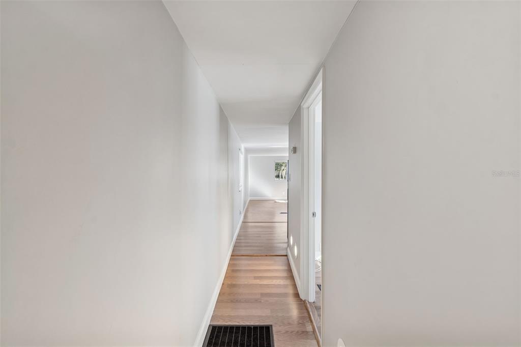 5464 South Wilson Point Homosassa, FL 34446 - Photo 25 of 39 a view of a hallway with wooden floor and a bathroom