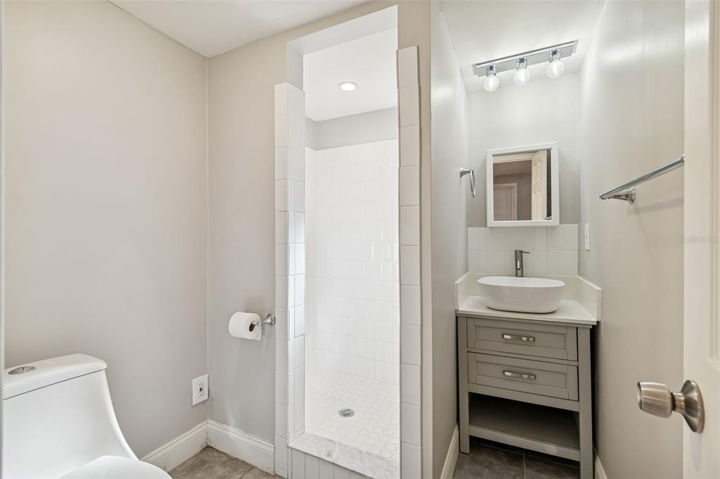 5464 South Wilson Point Homosassa, FL 34446 - Photo 30 of 39 a bathroom with a sink a toilet and shower