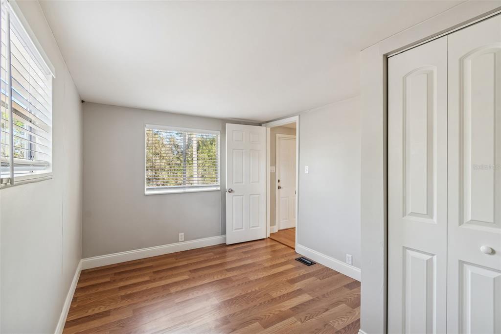 5464 South Wilson Point Homosassa, FL 34446 - Photo 33 of 39 a view of an empty room with wooden floor and a window