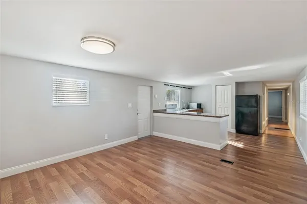a view of a kitchen with wooden floor