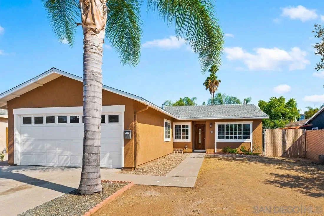 1445 Ronda Place Escondido, CA 92027 - Photo 2 of 15 a front view of a house with a garden