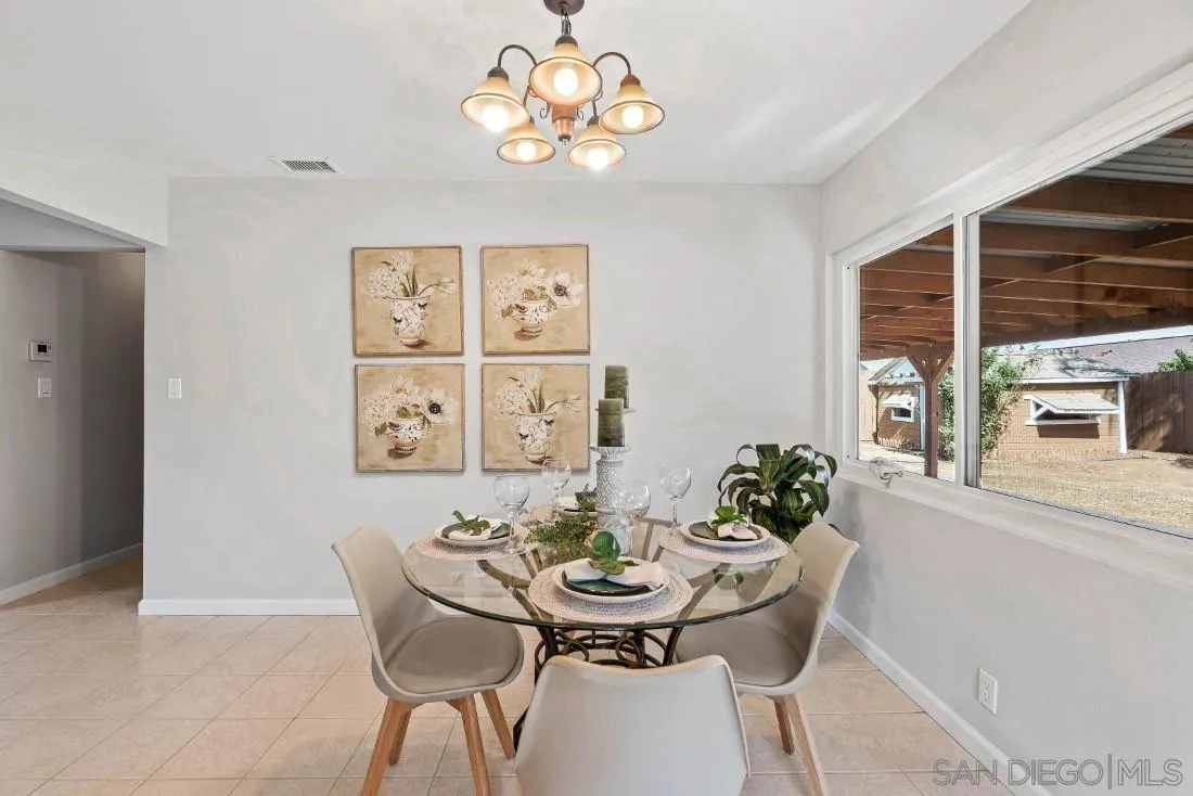 1445 Ronda Place Escondido, CA 92027 - Photo 5 of 15 a view of a dining room with furniture and chandelier