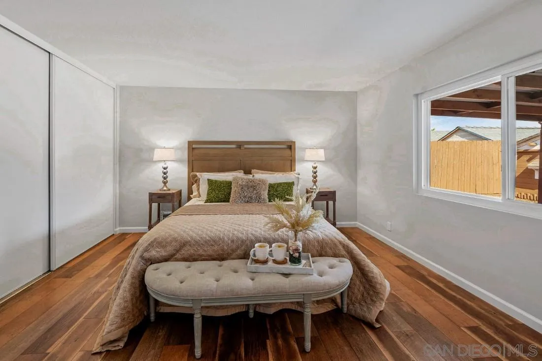 1445 Ronda Place Escondido, CA 92027 - Photo 8 of 15 a bedroom with a bed and wooden floor