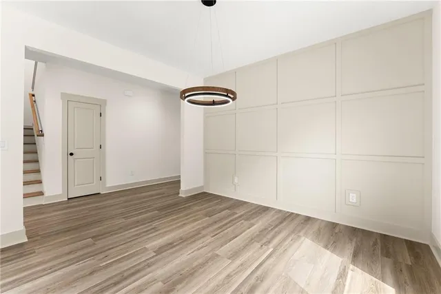 an empty room with wooden floor