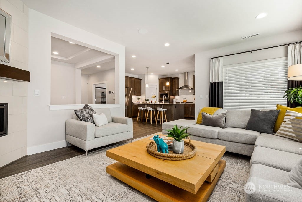 21535 6th Drive Southeast, Unit RM15 Bothell, WA 98021 - Photo 4 of 26 a living room with furniture kitchen view and a table