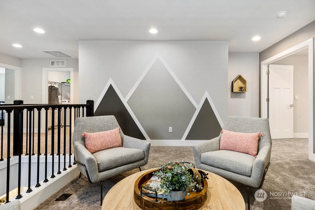 21535 6th Drive Southeast, Unit RM15 Bothell, WA 98021 - Photo 8 of 26 a living room with furniture and a rug
