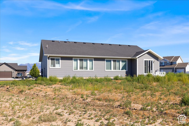 464 South Trejo Rdg Road Grantsville, UT 84029 - Photo 26 of 33 Rear view of property featuring a shingled roof