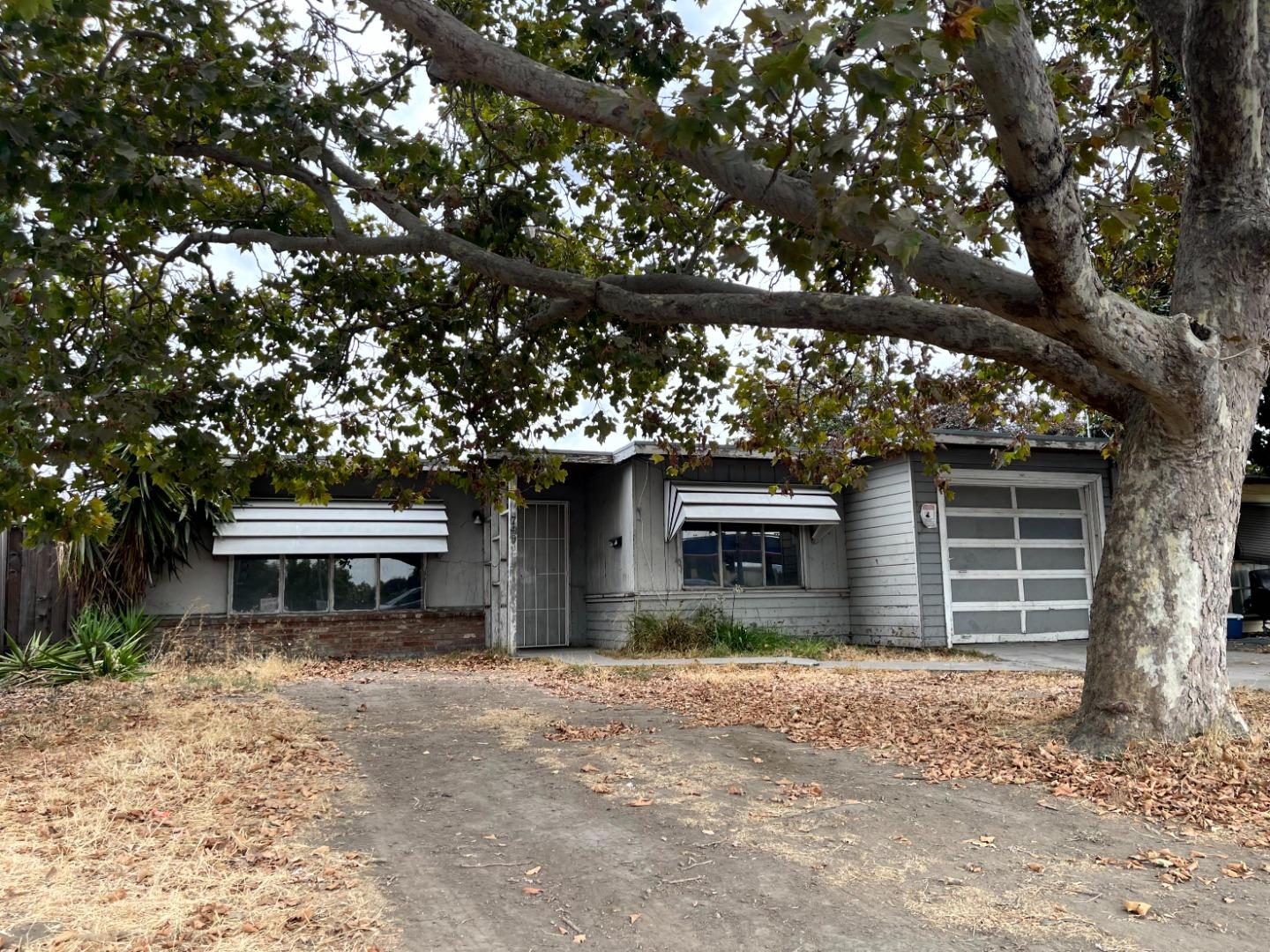740 South White Road San Jose, CA 95127 - Photo 5 of 6 a front view of a house with a yard and garage