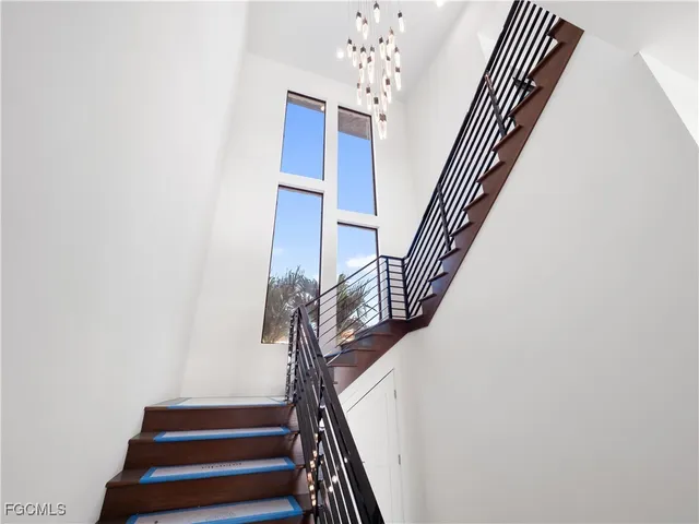 an empty room with windows and entrance