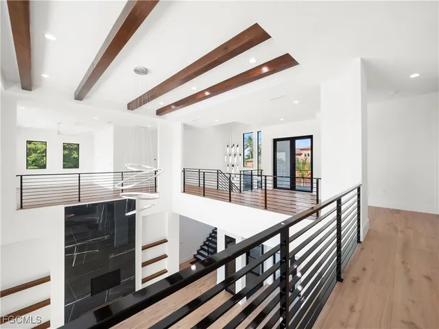 a bathroom with a double vanity sink toilet mirror and shower