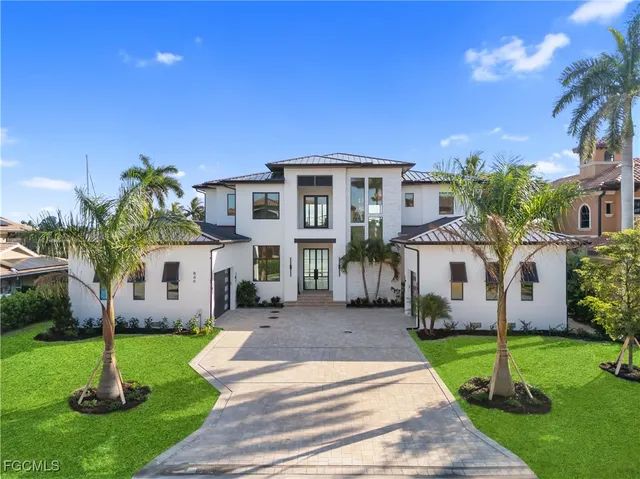 a view of a swimming pool with a table and chairs