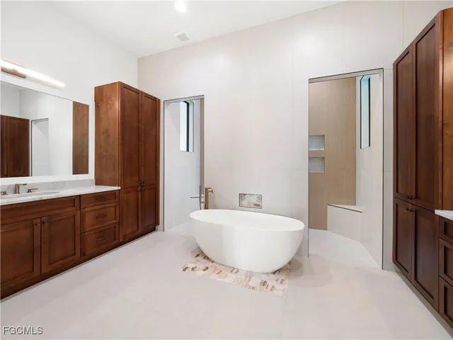 a view of a swimming pool with chairs