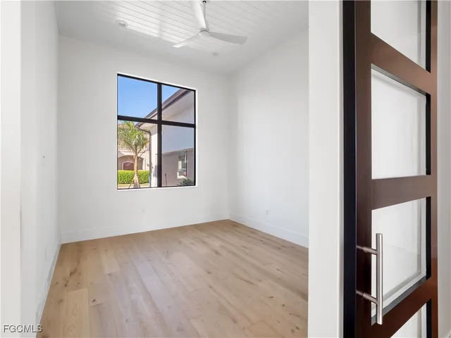 a view of a backyard with swimming pool
