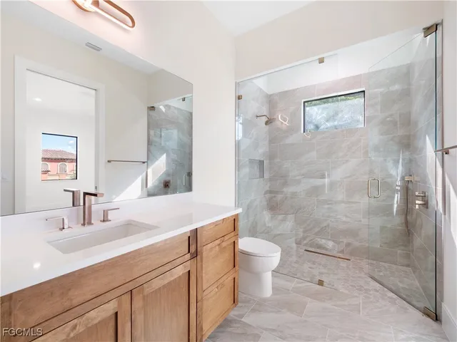 an aerial view of a balcony with chairs