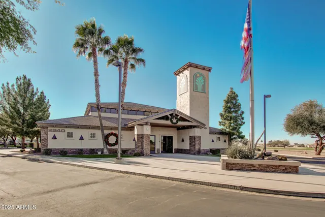 a view of a house with a yard and a fountain