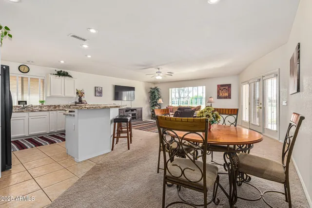 a kitchen with stainless steel appliances granite countertop a stove and a refrigerator