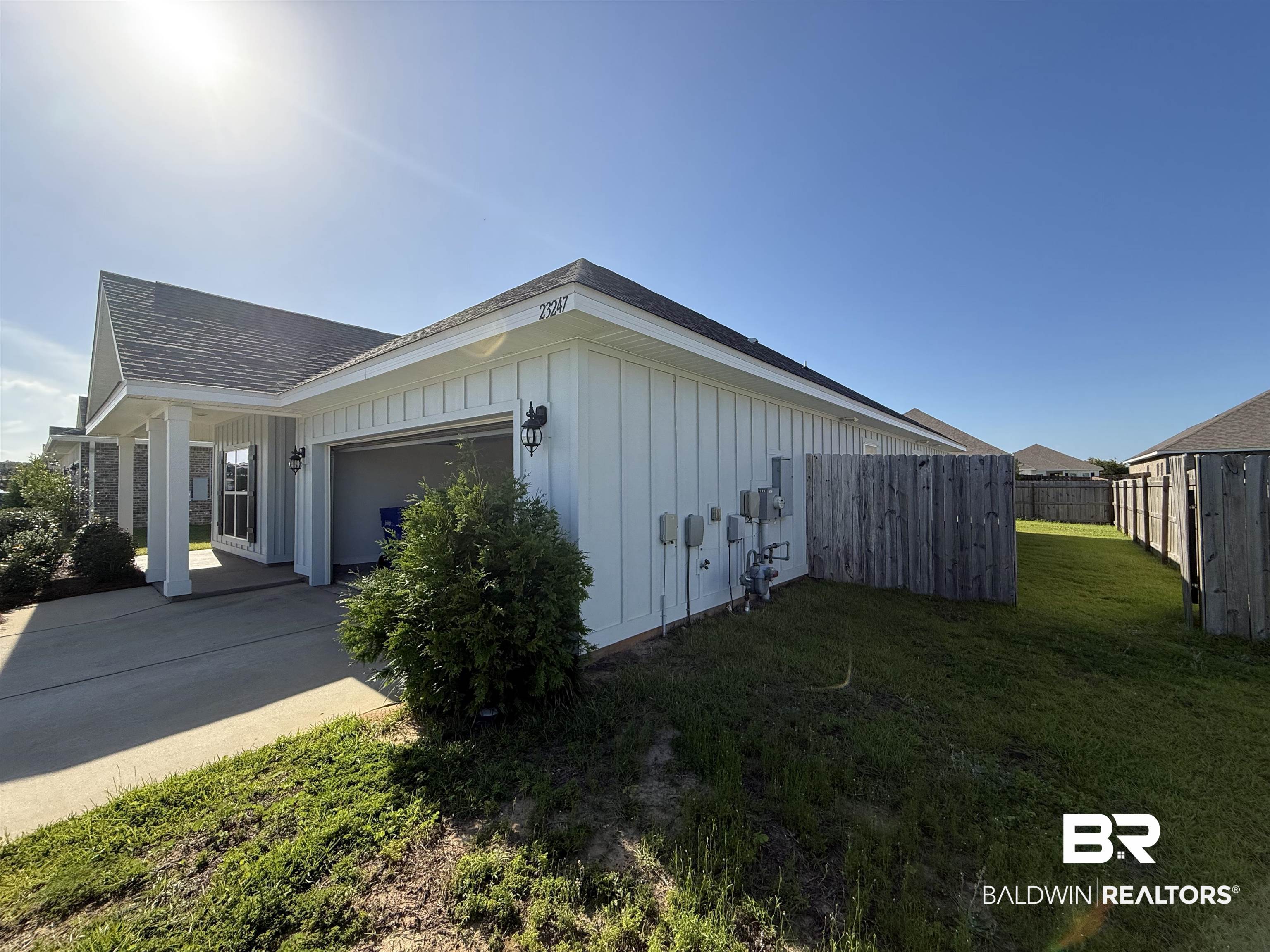 23247 Lieutenant Avenue Foley, AL 36535 - Photo 44 of 47 White vertical siding exterior with a dark shingle roof