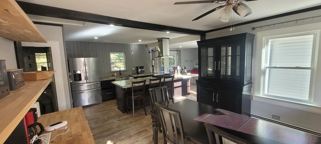 123 West River Road Hooksett, NH 03106 - Photo 12 of 40 a kitchen with a table and chairs in it